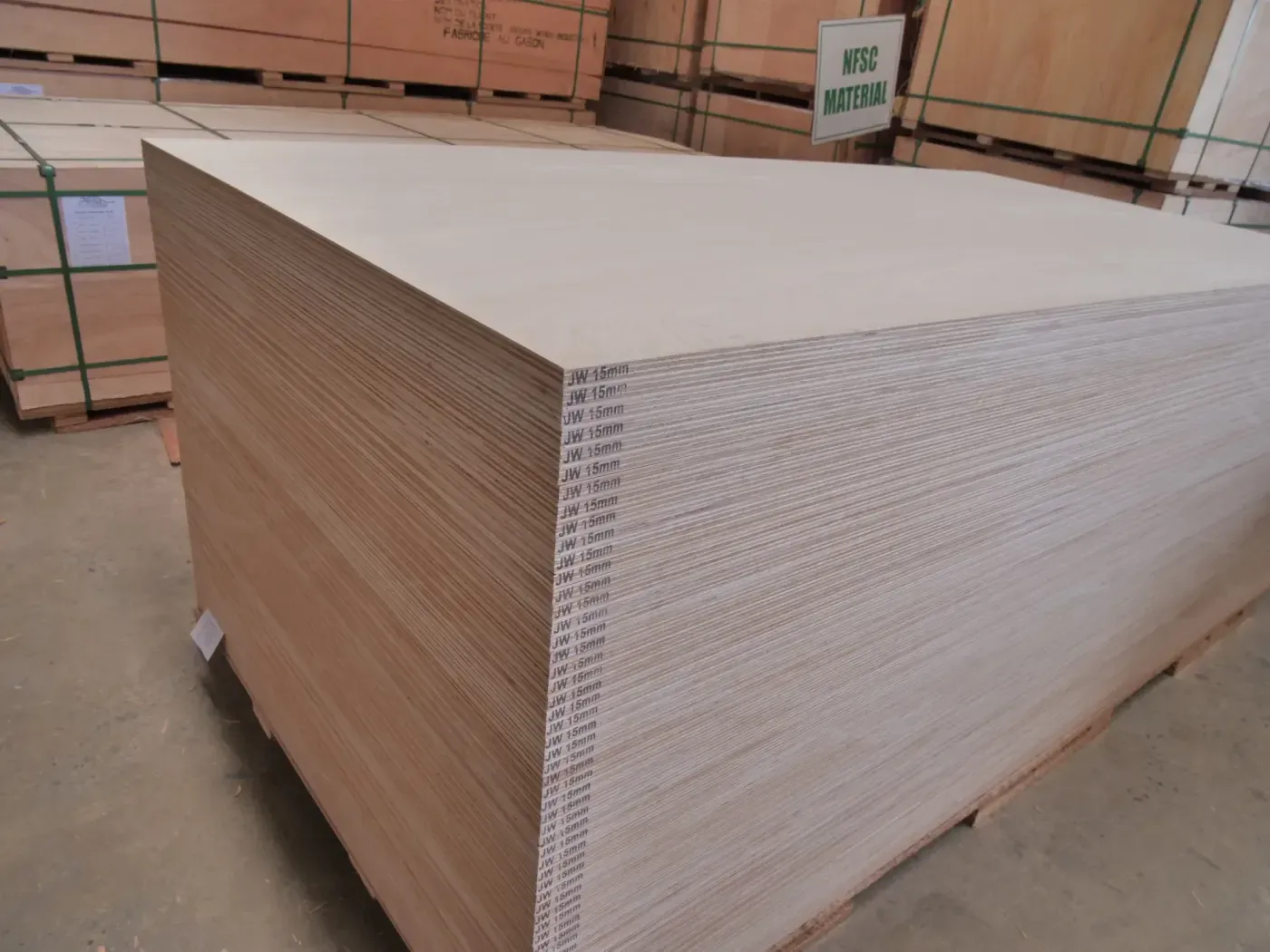 A pallet of JW 15 mm Okoume panels, edge-branded and ready for despatch