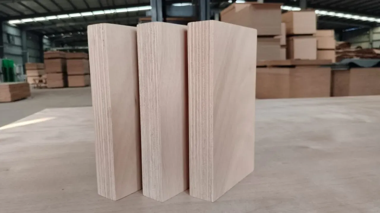 Okoume plywood panels stood on edge, showing the ply construction
